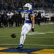 SDSU's running back Isaiah Davis (22) throws the ball on the ground after a touchdown on Friday, Dec. 15, 2023 at Dana J. Dykhouse in Brookings.